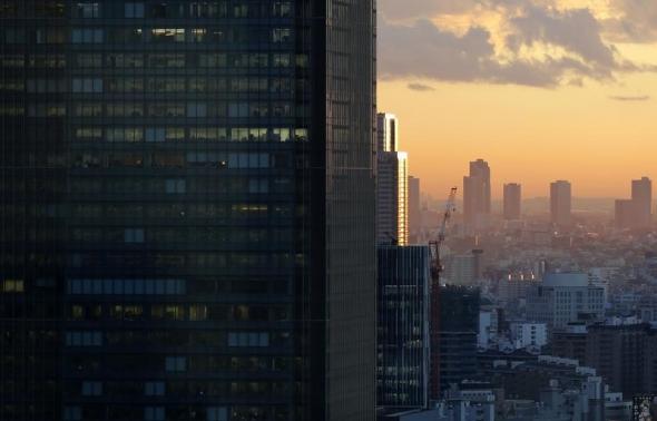 High-rise office buildings are seen during sunset in Tokyo December 10, 2013. High-rise office buildings are seen during sunset in Tokyo December 10, 2013.