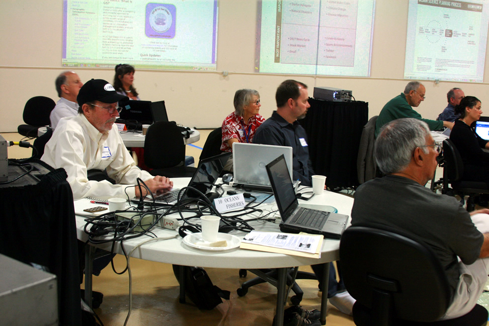 Allan Falconer comments on population issues as Mat Kaplan looks on and Ashley G