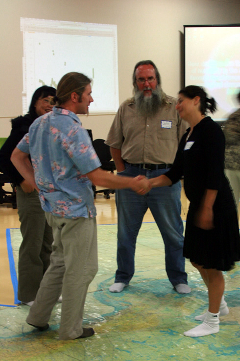 Monty Worthington meets Tracy Hughes on the map with Jacky Chan and John Graham looking on. Monty Worthington meets Tracy Hughes on the map with Jacky Chan and John Graham