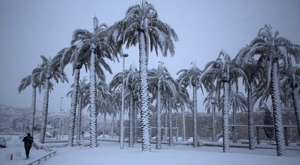 Snow blanketed Jerusalem on Thursday, an example of weather extremes that are growing more frequent and intense.