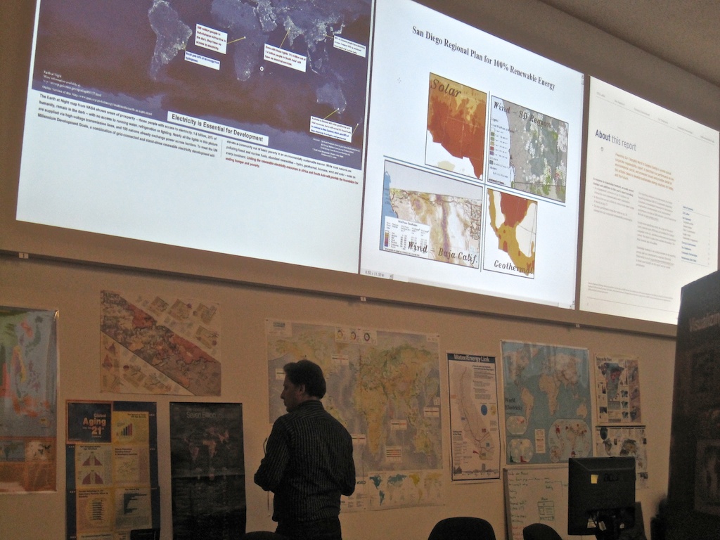 ...surrounded by 12 large screens and extensive visual resources.