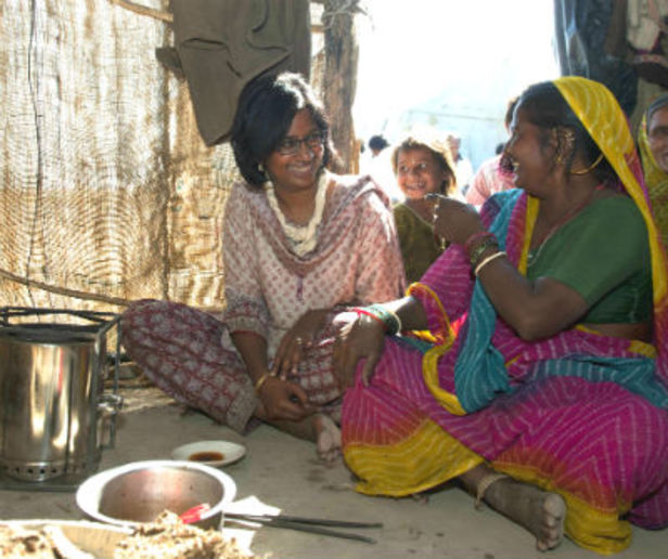 Rahda Muthiah, left, talks with a woman using an improved cookstove in Gujarat, India. Photo: Romana Manpreet, Global Alliance for Clean Cookstoves. Rahda Muthiah, left, talks with a woman using an improved cookstove in Gujarat, India. Photo: Romana Manpreet, Global Alliance for Clean Cookstoves.