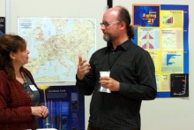 Andre Skupin discussing GIS visualization tools with Lisa Pierce.