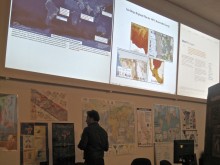 ...surrounded by 12 large screens and extensive visual resources.