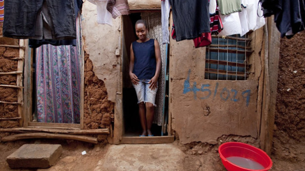 Dorees stands in the doorway of her home in the slums of Kibera, Kenya. Poverty is multidimensional, with living standard being one of the three dimensions identified by the Oxford Poverty and Human Development Initiative. Photo by: Gates Foundation / CC BY-NC-ND Dorees stands in the doorway of her home in the slums of Kibera, Kenya. Poverty is multidimensional, with living standard being one of the three dimensions identified by the Oxford Poverty and Human Development Initiative.